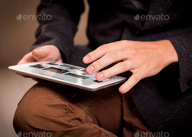Tablet in Hand Mockup Template